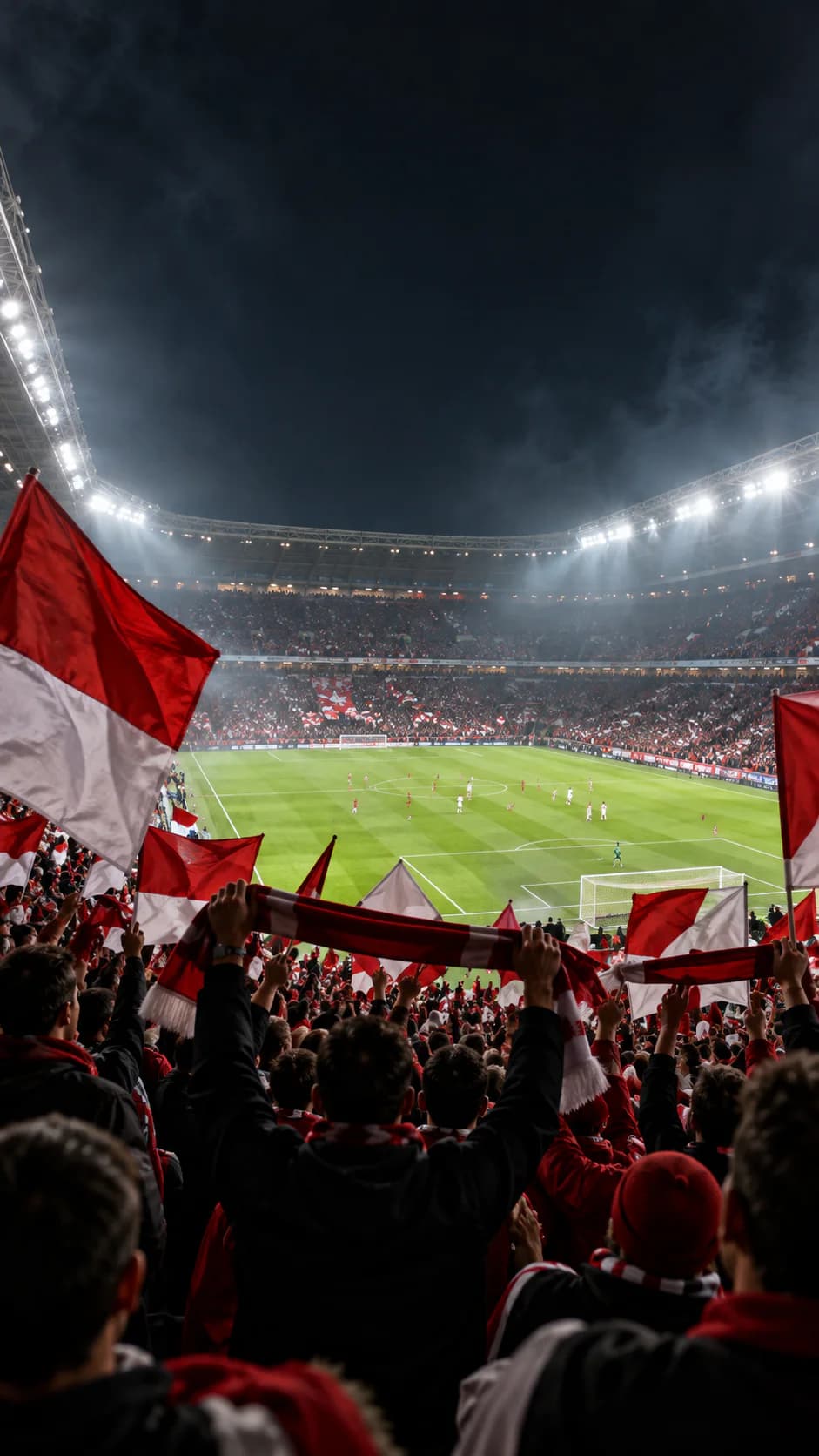 Tribuna di uno stadio illuminata durante una partita